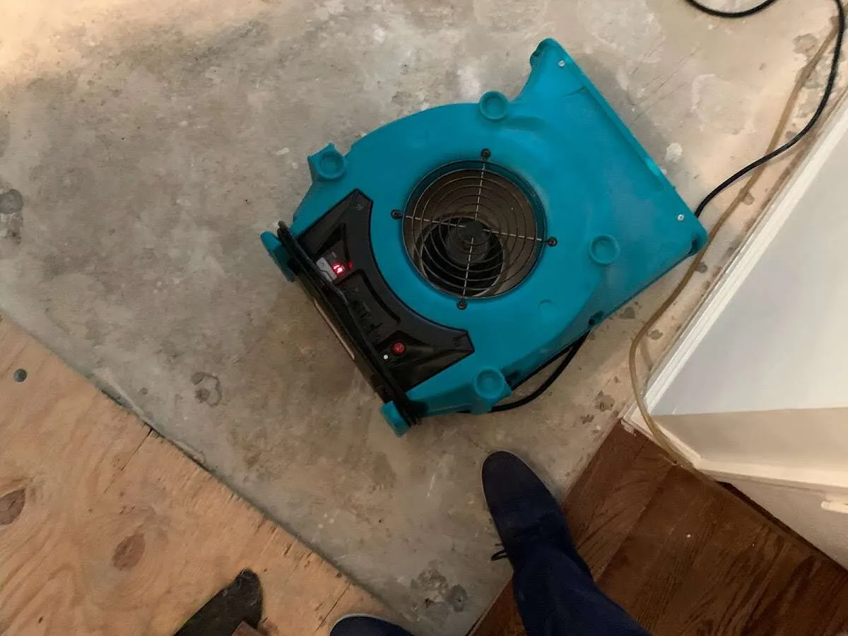 Air mover drying subfloor during Commercial Water Damage Restoration in Palo Alto